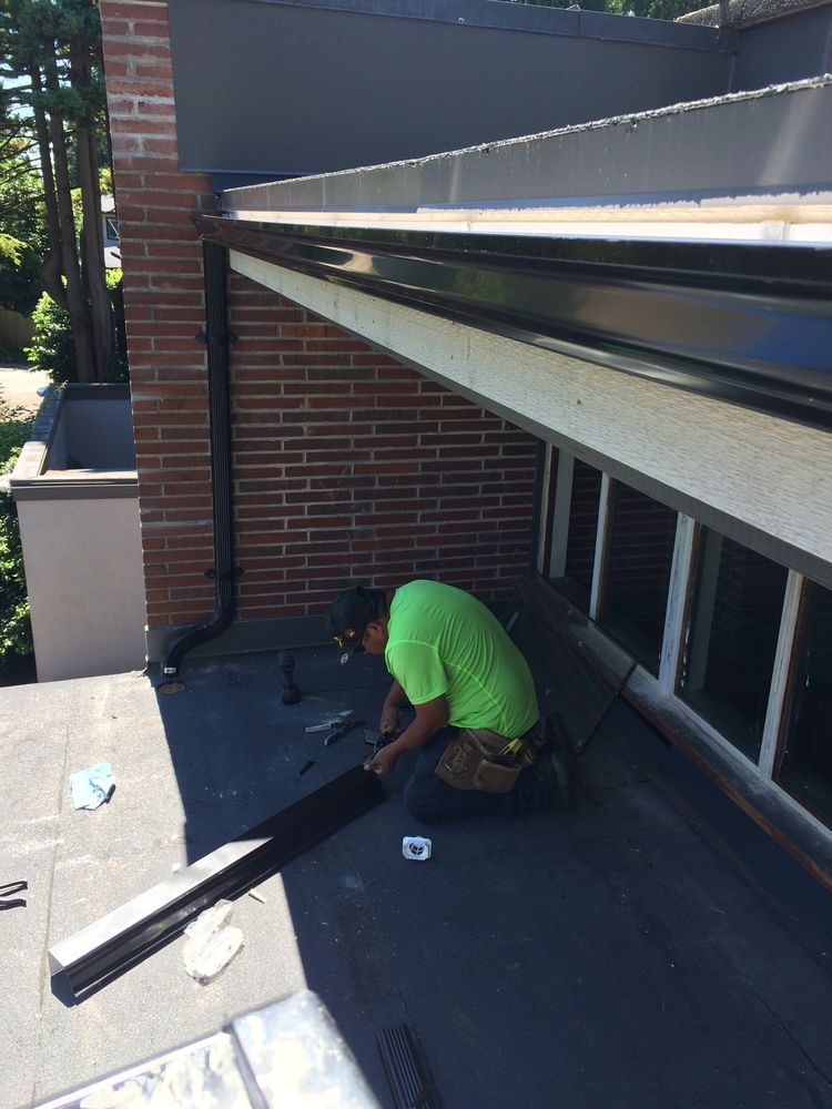New black fascias, soffits and gutters being installed